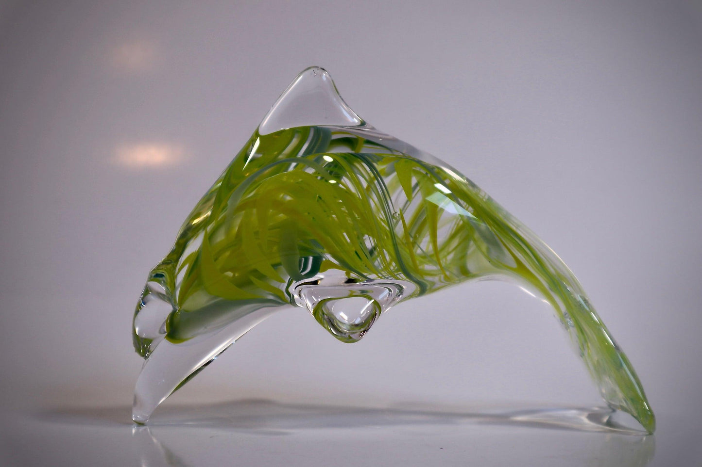 Glass dolphin sculpture